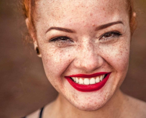 Smiling woman with red hair